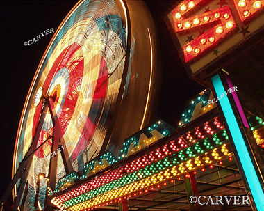 Night at the Fair
The ferris wheel turns it's bright lights while rows of color call riders to the bumper cars nearby.
A long duration exposure from the Topsfield Fair.
Keywords: Topsfield Fair; ferris wheel; color; photograph; picture; print