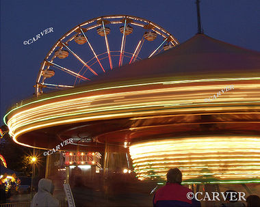Moving in Circles
From the Topsfield Fair. A carousel turns in the foreground while a ferris wheel does the same.
Keywords: Topsfield Fair; ferris wheel; carousel; color; photograph; picture; print