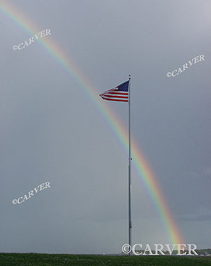  True Colors
An American Flag snaps furiously in the winds of a passing
thunderstorm as a rainbow brightens a dark and murky sky.
Keywords: rainbow; flag; wind; color; Beverly; art; photograph; picture; print